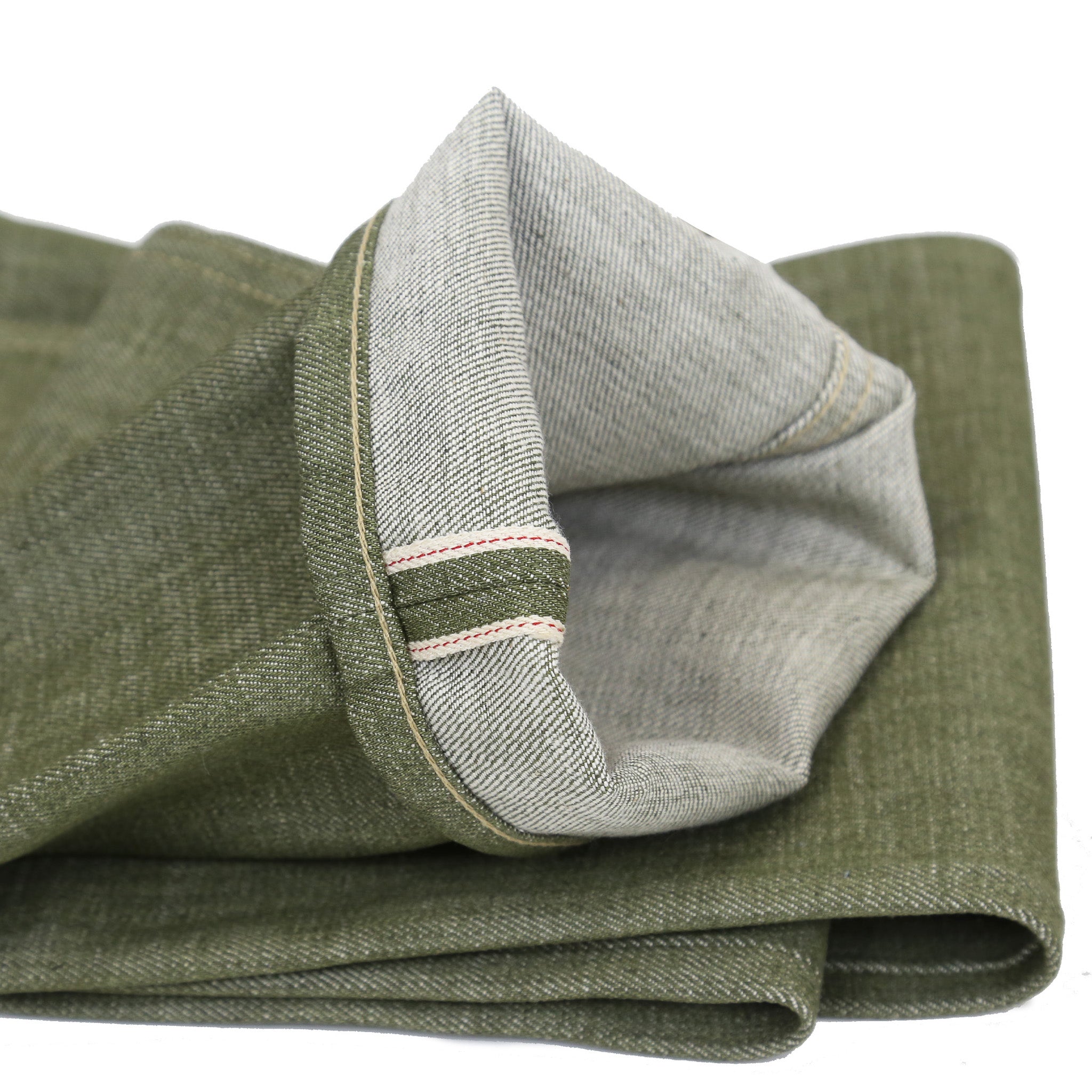 Cuff Detail of A pair of pistachio green, medium high waist, straight leg Railcar Drifter denim jeans